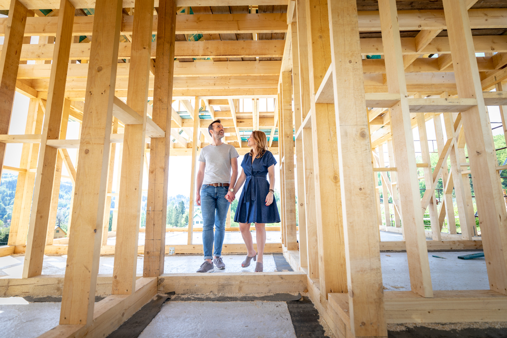 Couple seeing their dream home being constructed